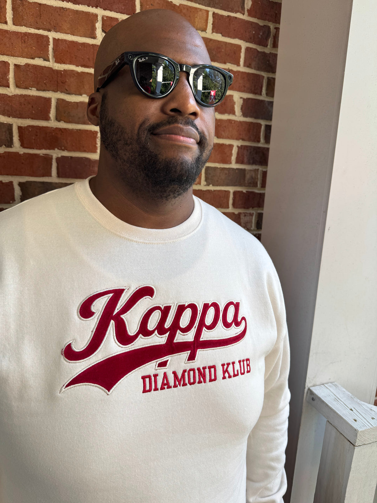 Close-up view of raised satin stitch Diamond Klub embroidery on Kappa Alpha Psi Cream sweatshirt