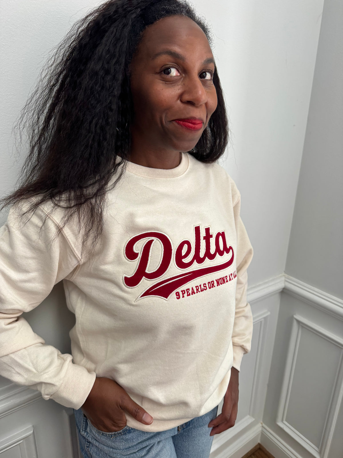 Delta Sigma Theta 9 Pearls or None at All crimson embroidered crewneck sweatshirt front view