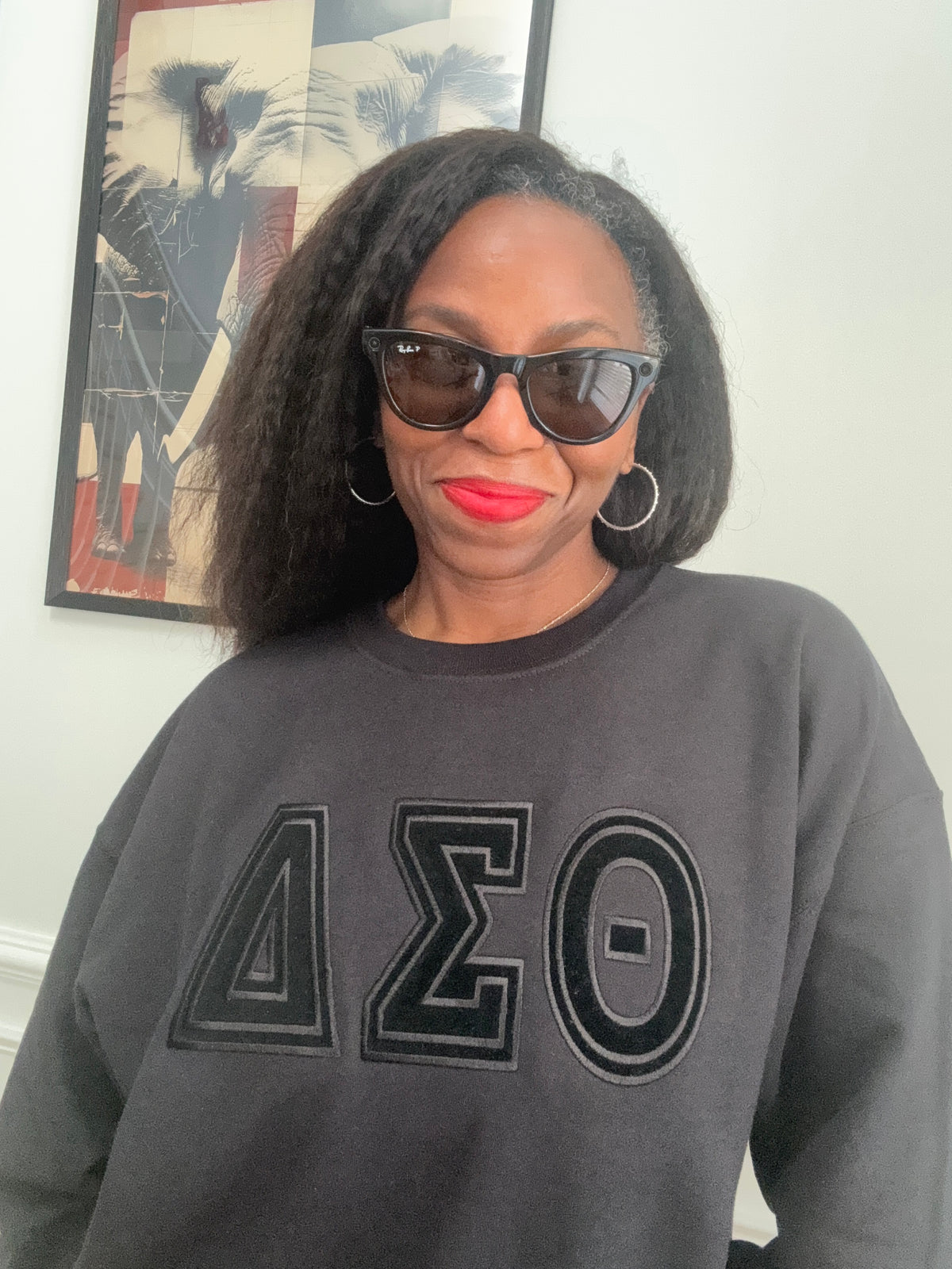 Close-up high-density tonal black embroidered Delta Sigma Theta Greek letters on sweatshirt