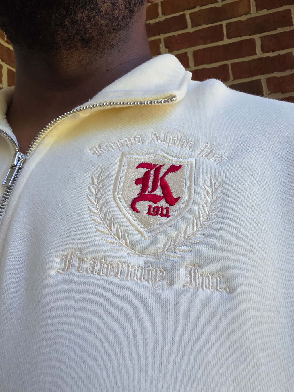 Close-up view of stand-up collar, zip closure, and high-density Kappa Alpha Psi chest embroidery