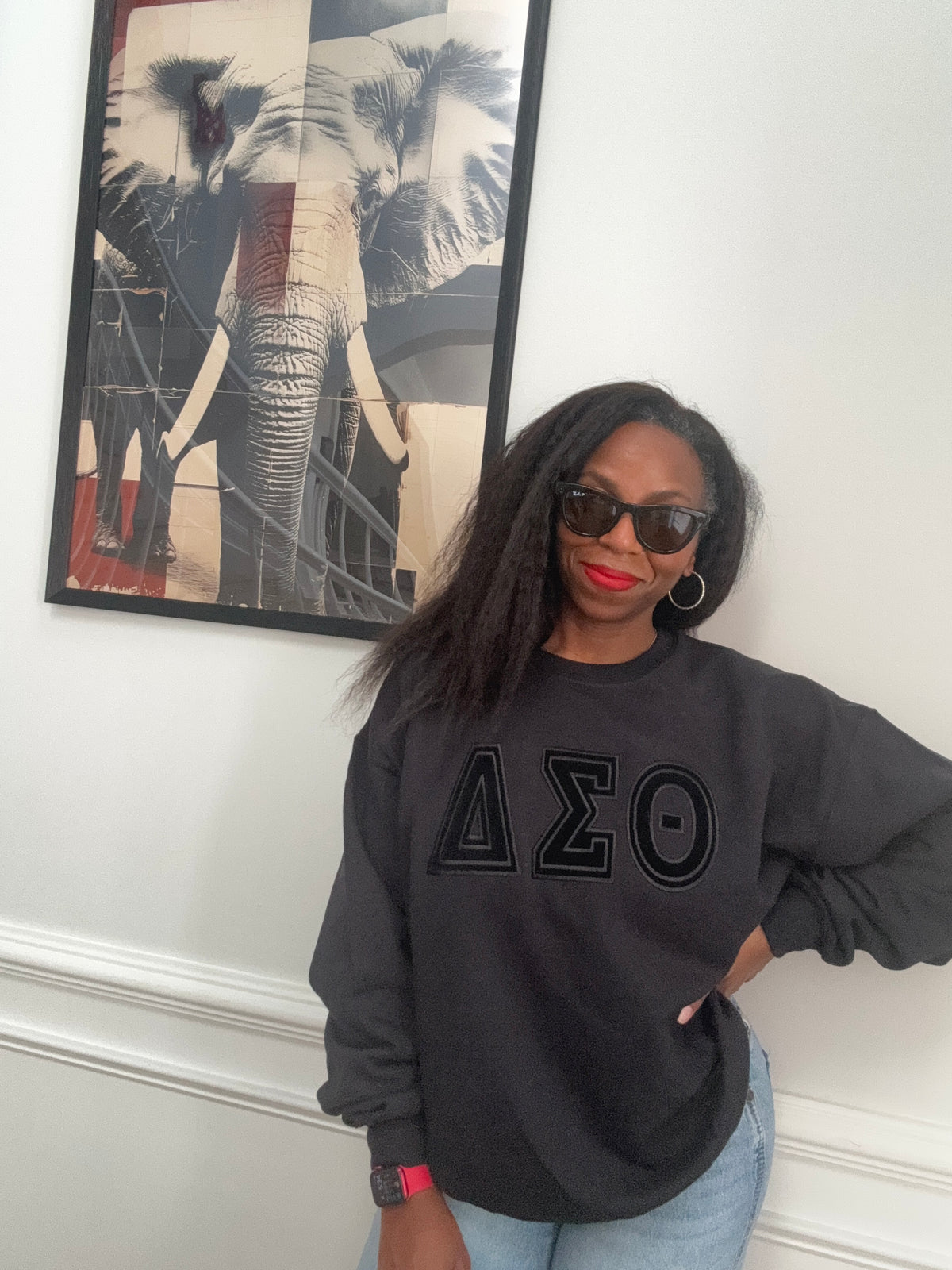 Delta Sigma Theta black-on-black embroidered crewneck sweatshirt front view on black heavy fleece