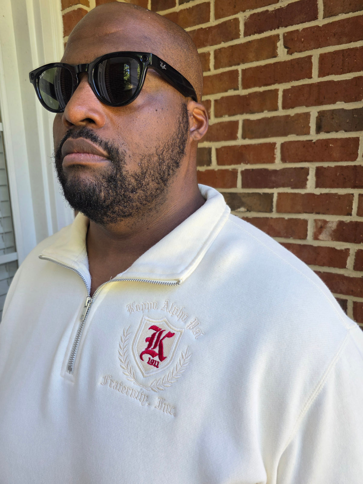 Kappa Alpha Psi cream quarter-zip fleece pullover with embroidered Greek letters across chest front view